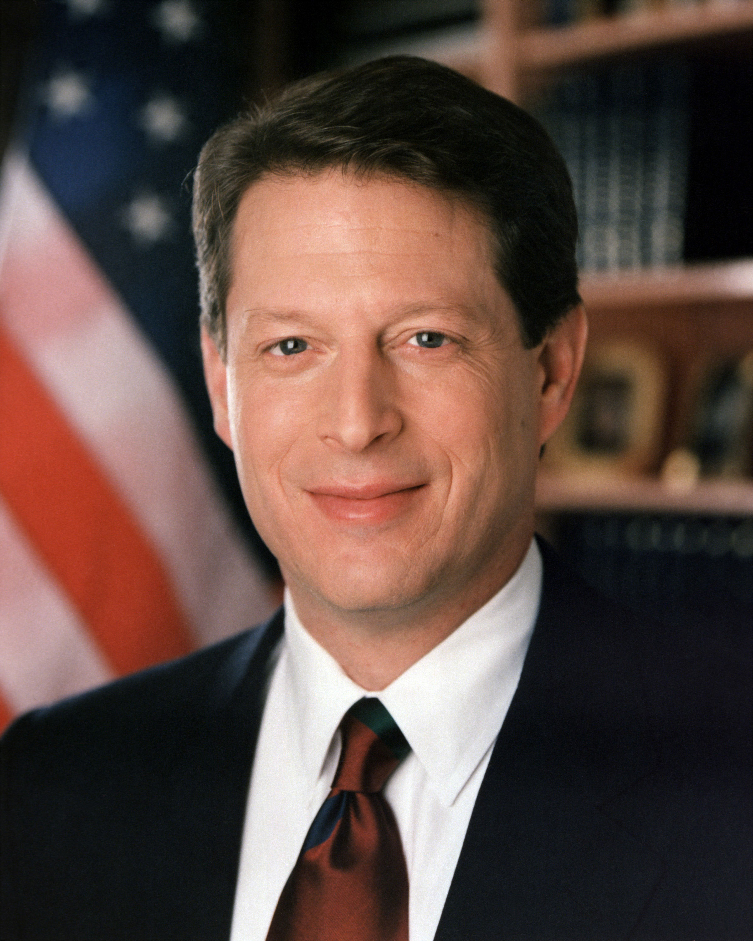 Al Gore's official 1994 Vice Presidential portrait, head and shoulders, wearing a dark suit and tie against a plain background.