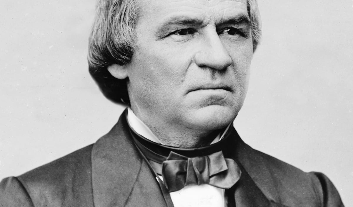 Andrew Johnson in a photographic portrait from the 1870s, in a dark coat and bow tie.