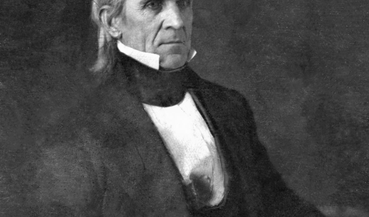 James K. Polk in an early photographic portrait, in a dark coat and white cravat.