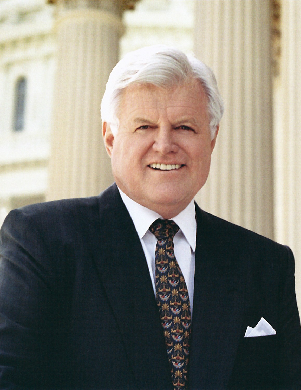 Official United States Senate portrait of Ted Kennedy, head and shoulders, in a dark suit against a plain background.
