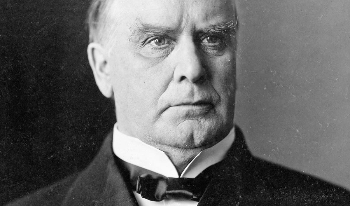 William McKinley in a photographic portrait, in a dark coat and bow tie.